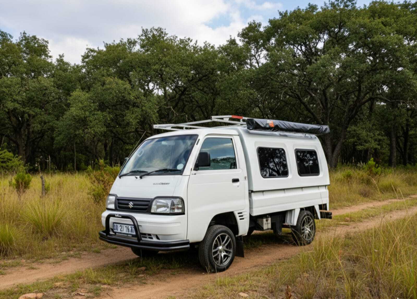 Accessorised Suzuki Super Carry on gravel road