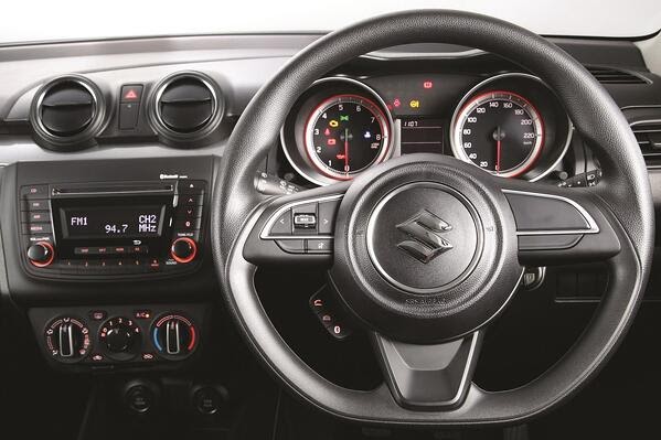 Interior of the Suzuki Swift showing steering console and radio