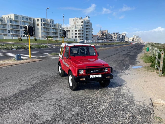 Red Suzuki 87 SJ410