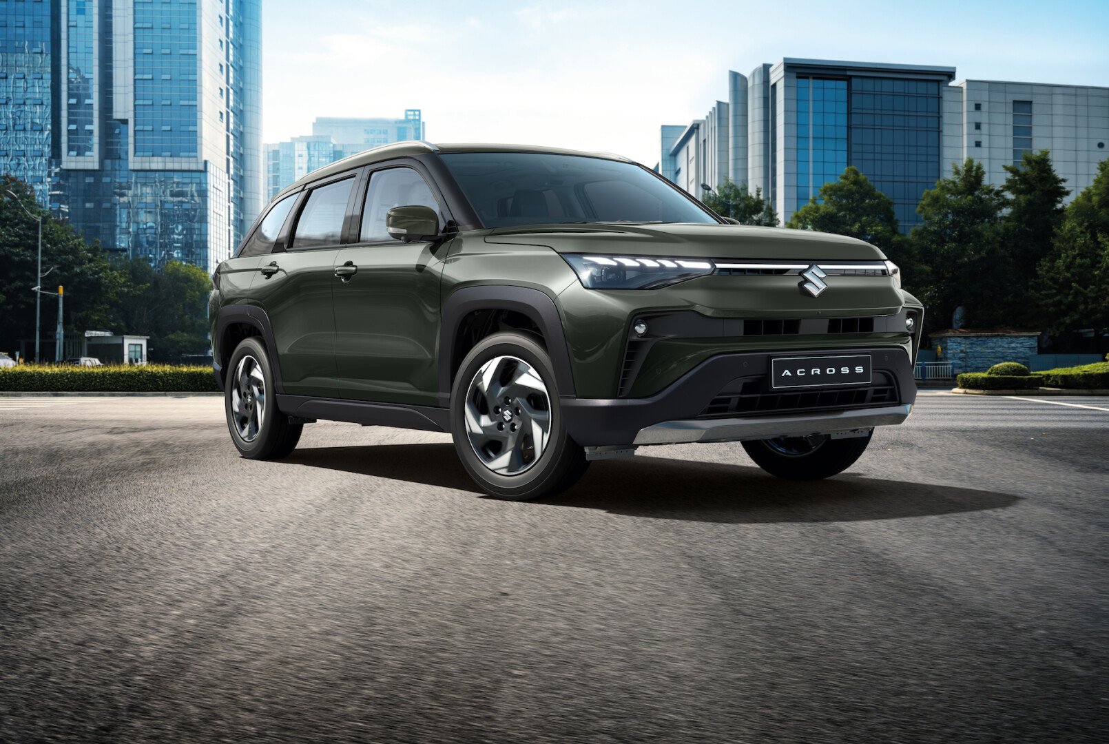 Green Suzuki Across in the road 