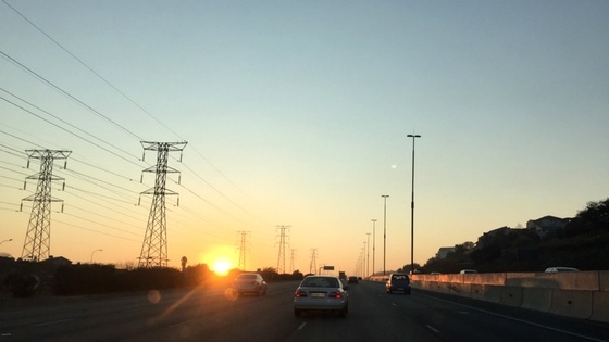 Sunset and cars on a road