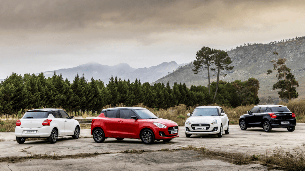 four suzuki swifts parked in nature