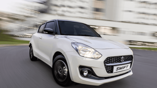 Suzuki Swift in white parked on tar road