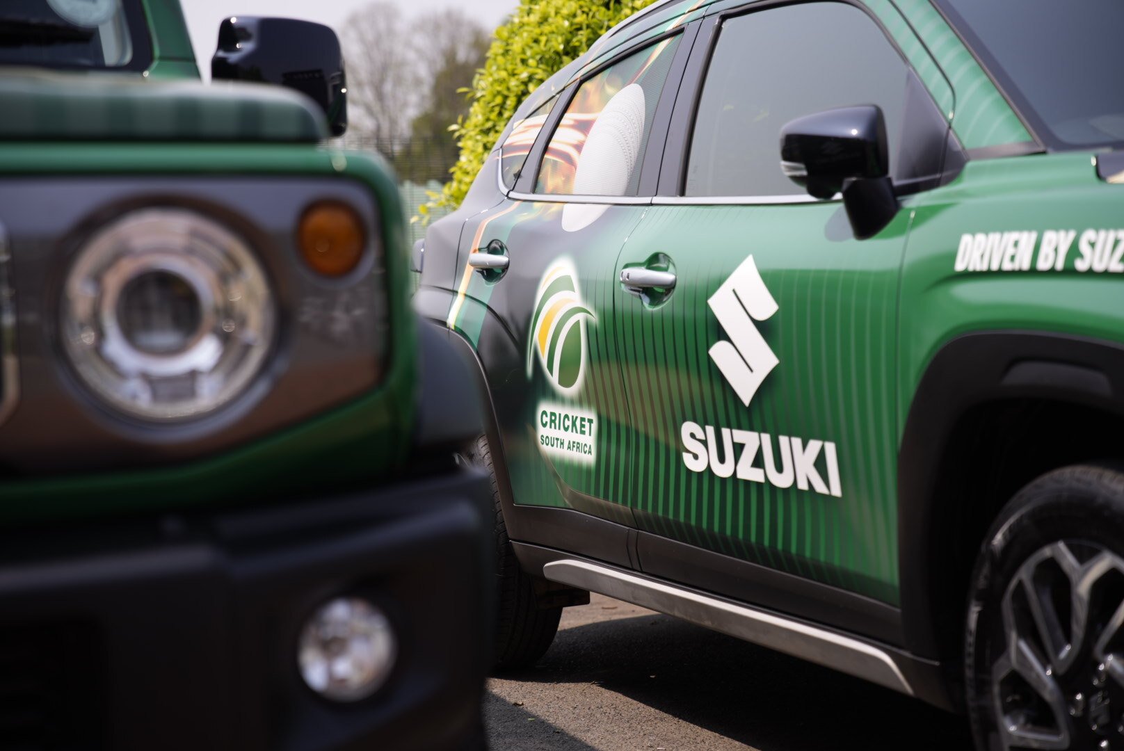 Two branded Suzuki vehicles with Proteas and Suzuki branding