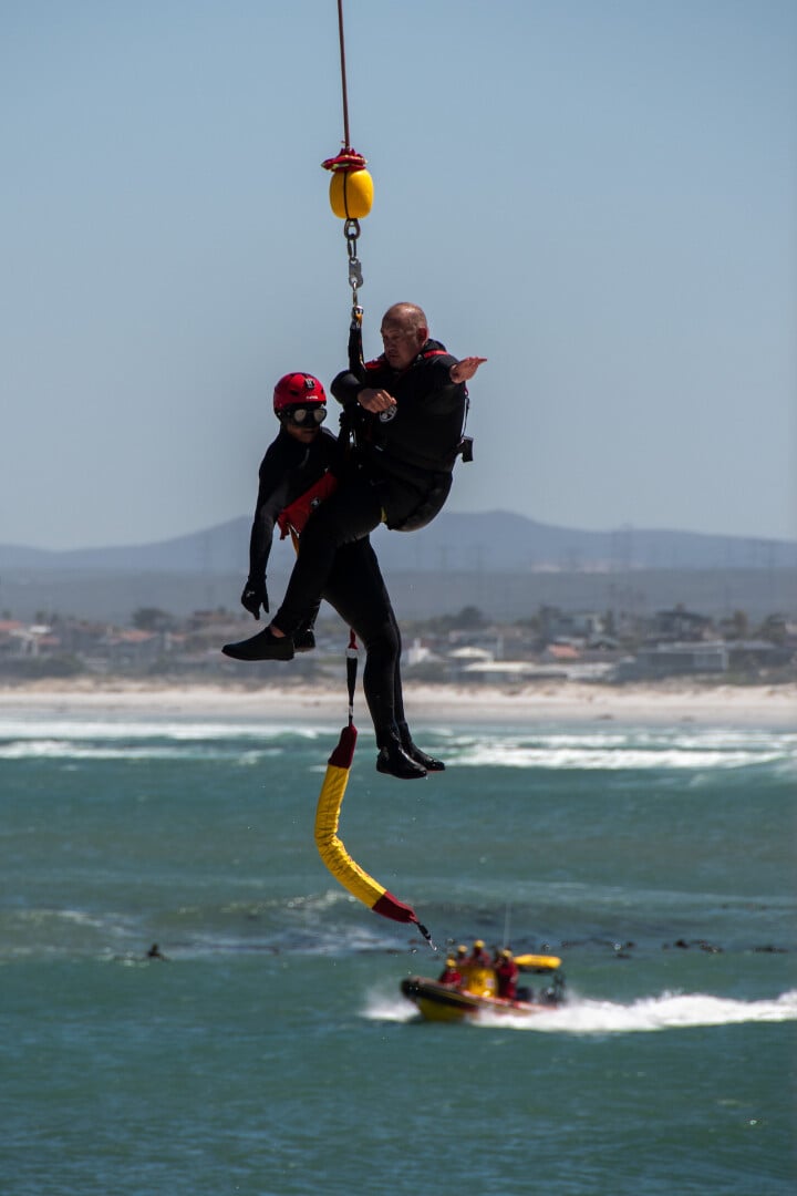 people-hanging-by-the-robe-over-the-beach