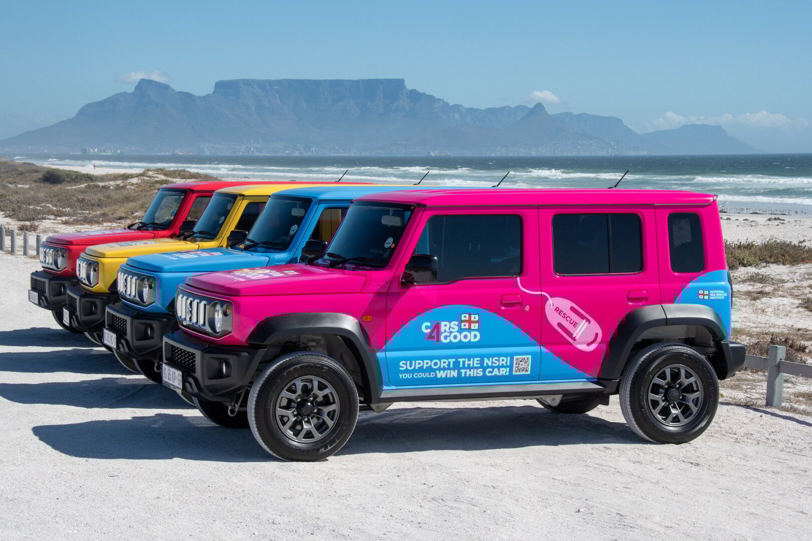 suzuki-jimnys-by-the-beach-in-front-of-table-mountain