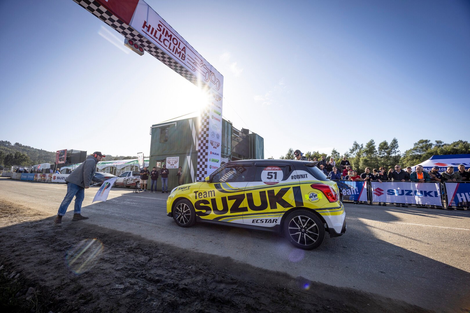Yellow and black Suzuki Swift at Simola race track