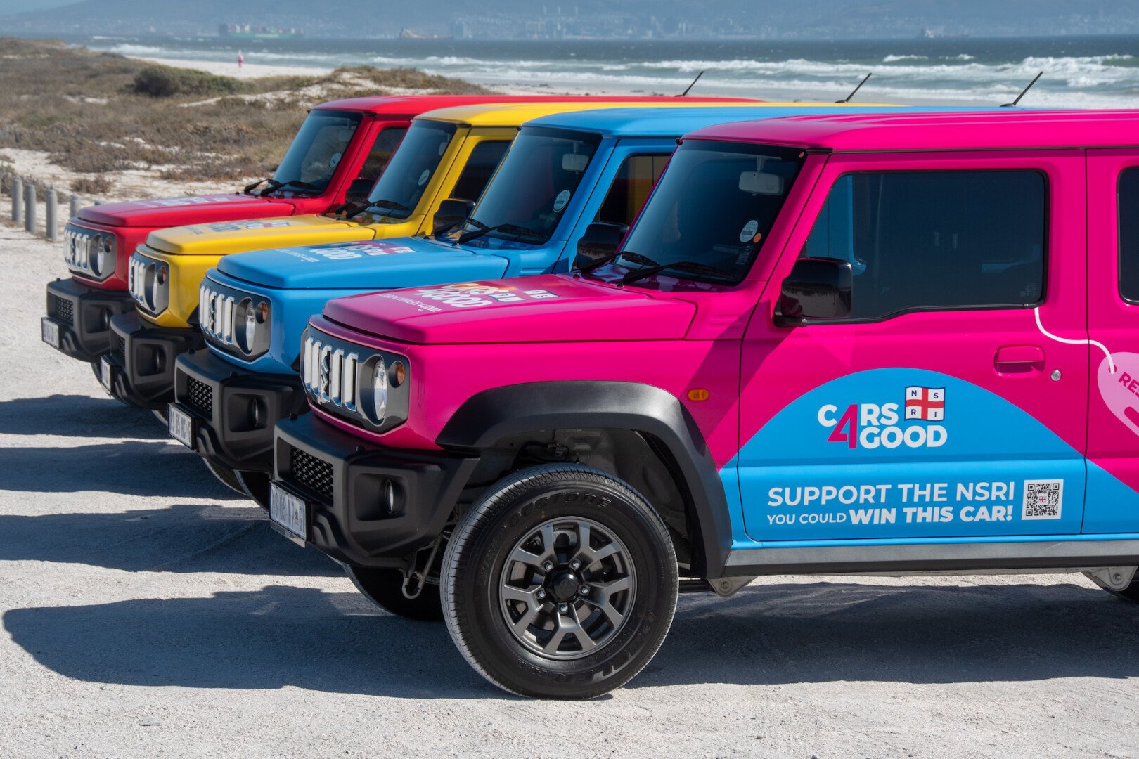 Suzuki Jimny's lined up by the beach